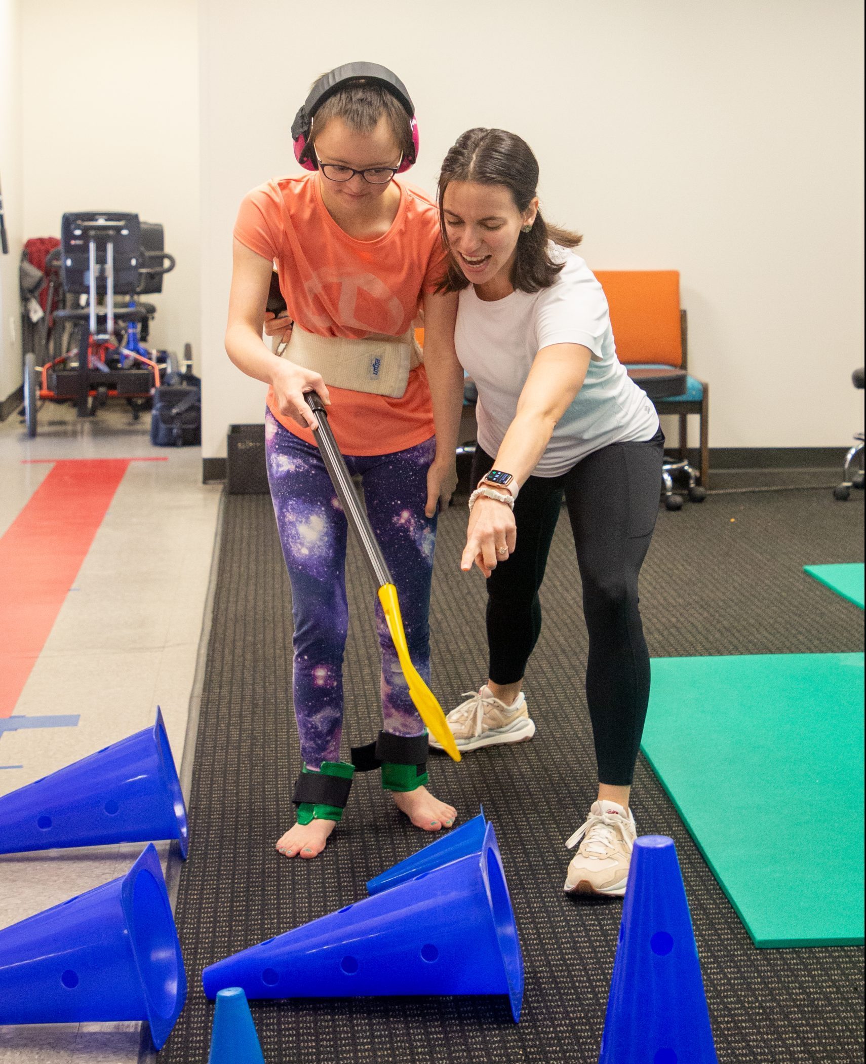 Pediatric therapists helps a young child with down syndrome at Pediatric Therapy Center in Houston